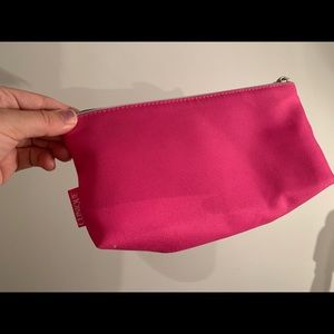 Hot pink Clinique make up bag